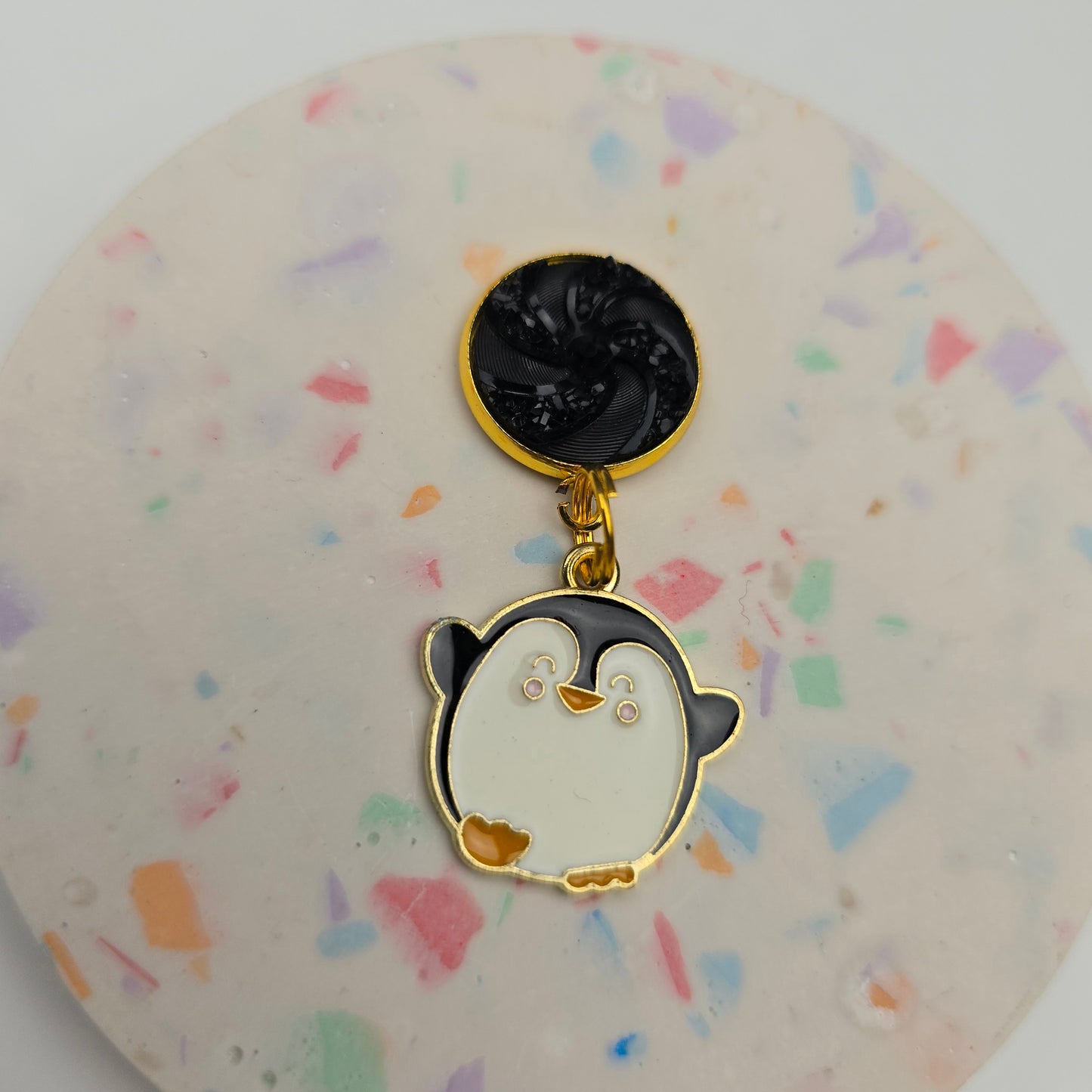 Discontinued Penguin with a black swirl top Dangly