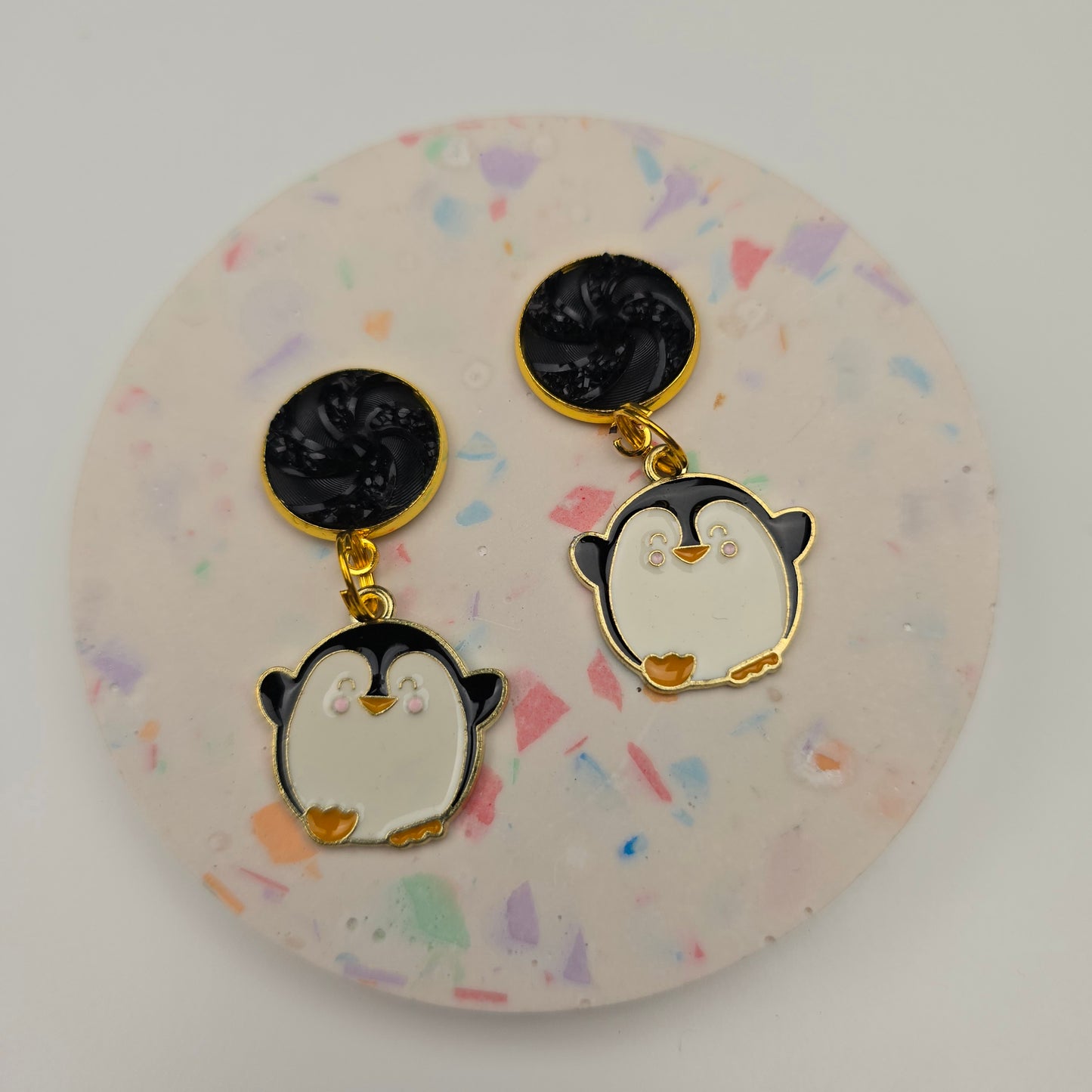 Discontinued Penguin with a black swirl top Dangly
