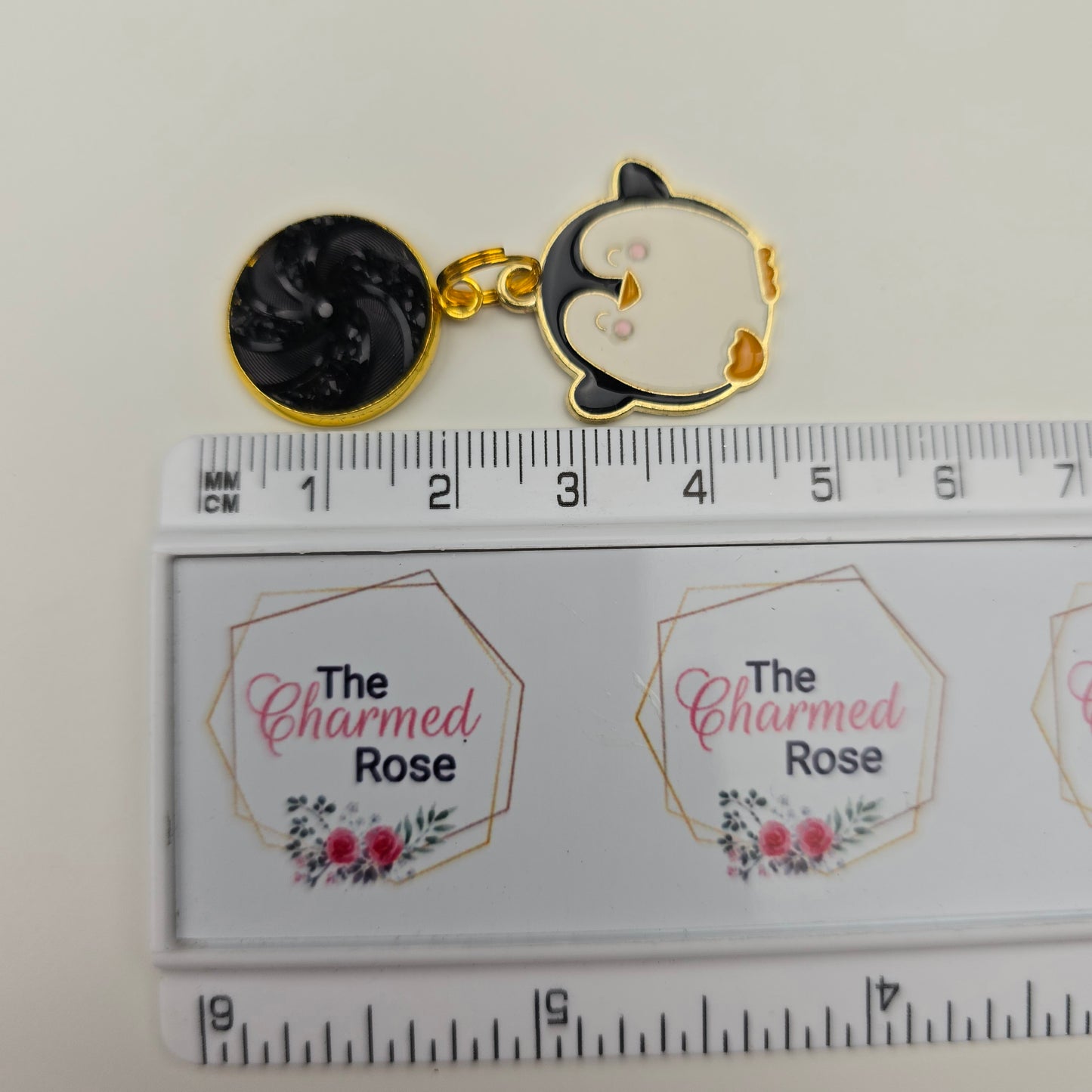Discontinued Penguin with a black swirl top Dangly