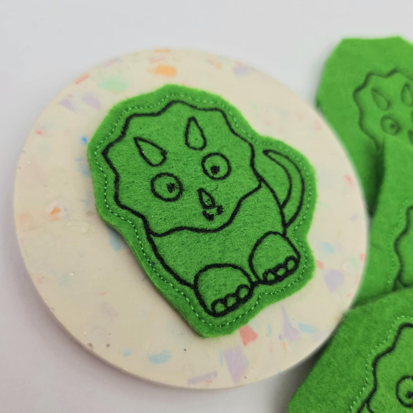 Green dinosaur feltie