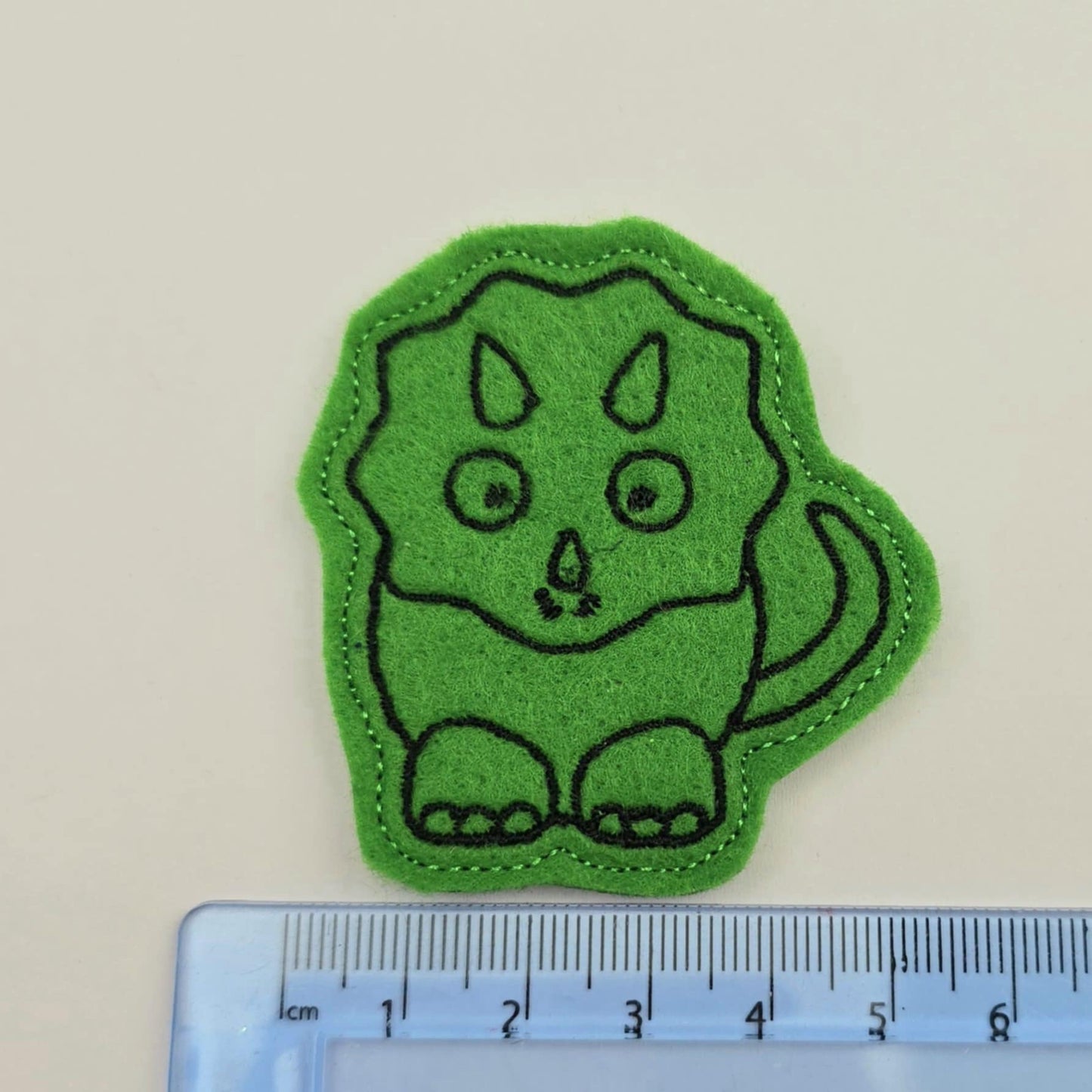 Green dinosaur feltie