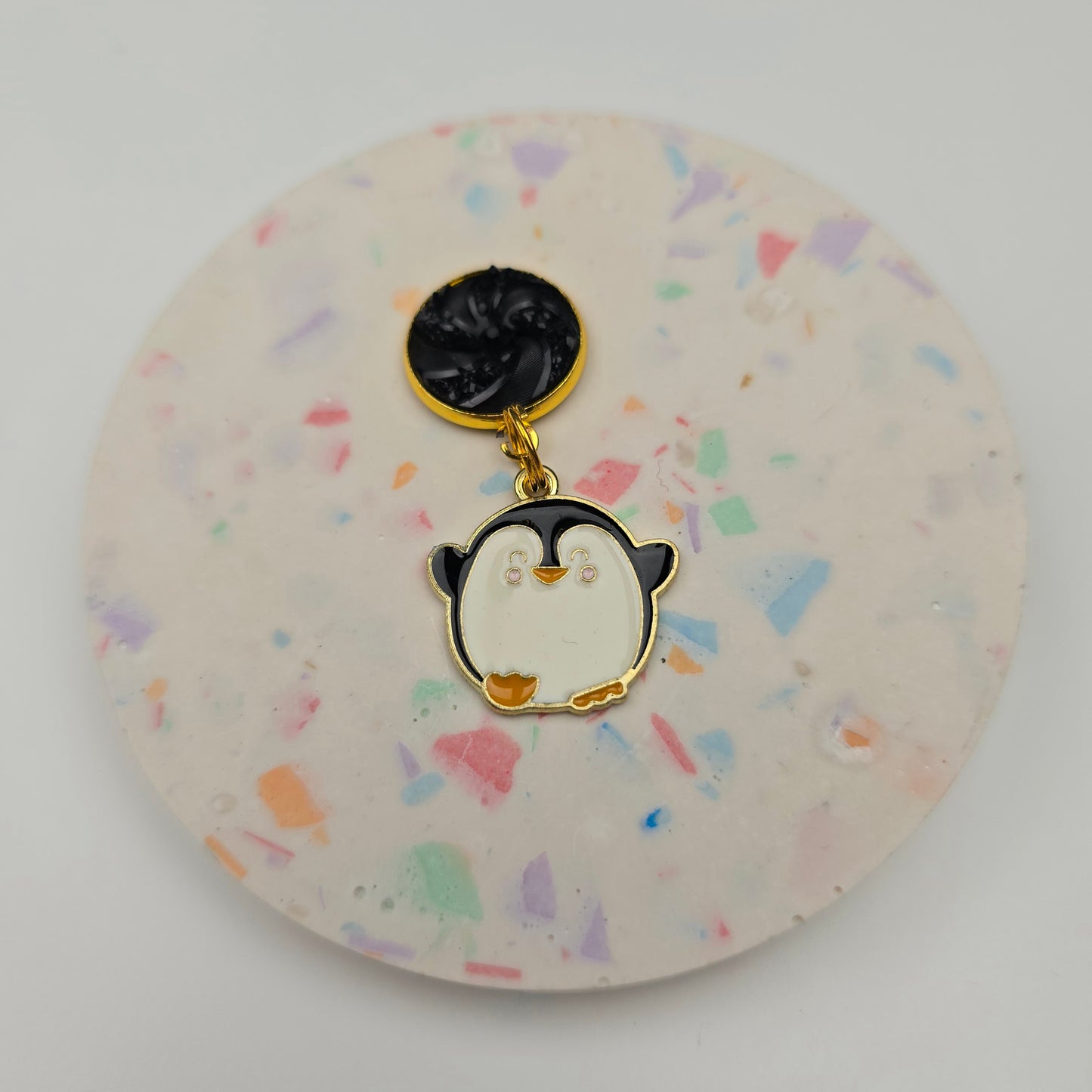 Discontinued Penguin with a black swirl top Dangly