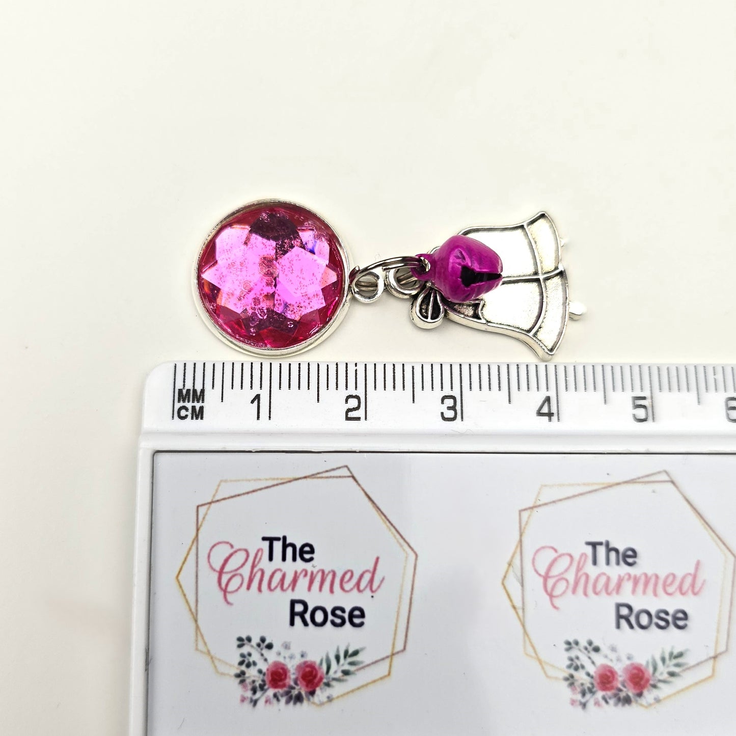 Pink Christmas bells charm Dangly